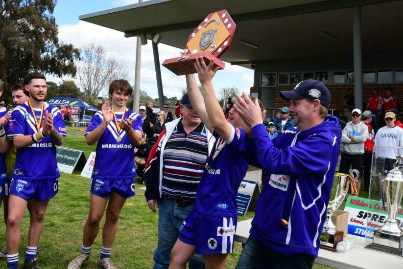Molong captain George Betts lifts the Woodbridge Cup Youth League trophy. Picture by Jude Keogh 