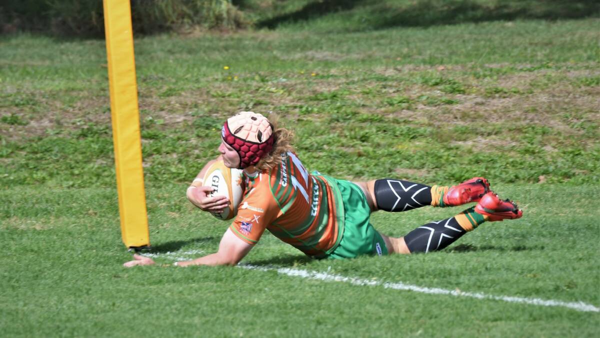 TRY-TIME: Aidan Fraser crosses the line in Orange City's trial match. Photo: CHRIS SEABROOK
