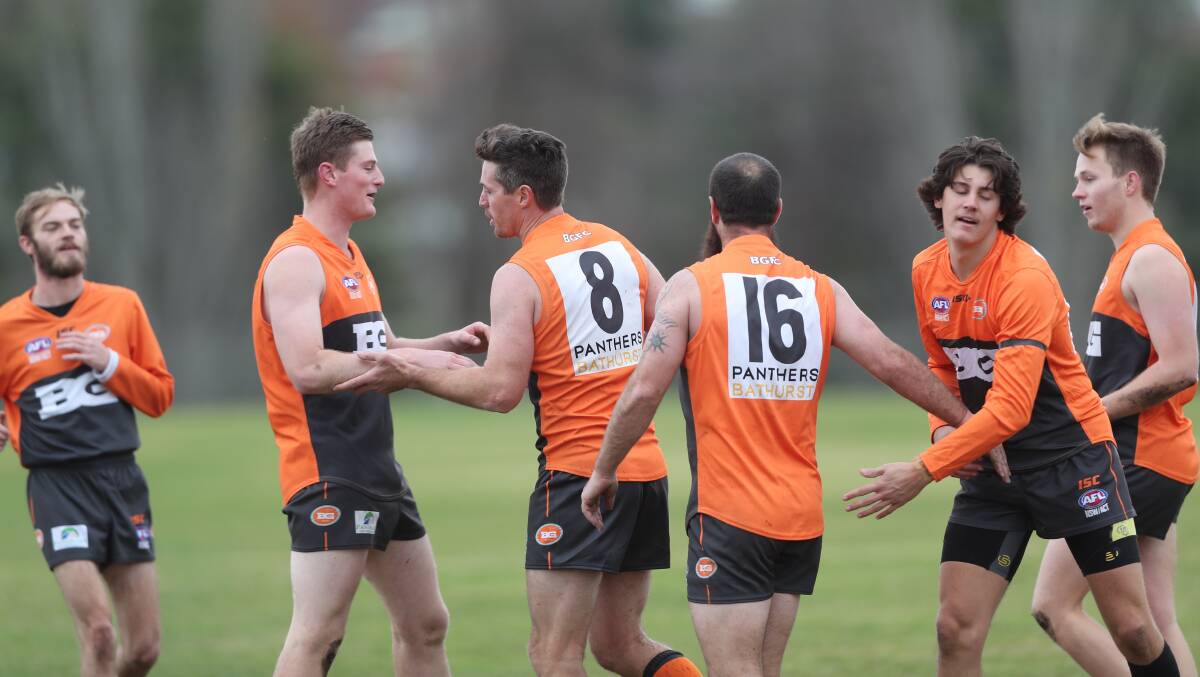 STAR RECRUIT: Lenny Hayes (#8) celebrates with his new Bathurst Giants team-mates on Saturday after kicking a goal. Photo: PHIL BLATCH