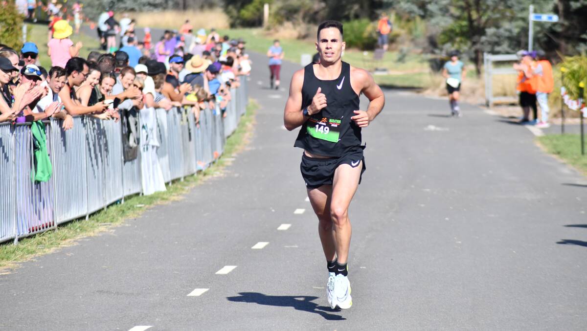 Zac Rosser approaches the finish line. Picture by Jude Keogh 