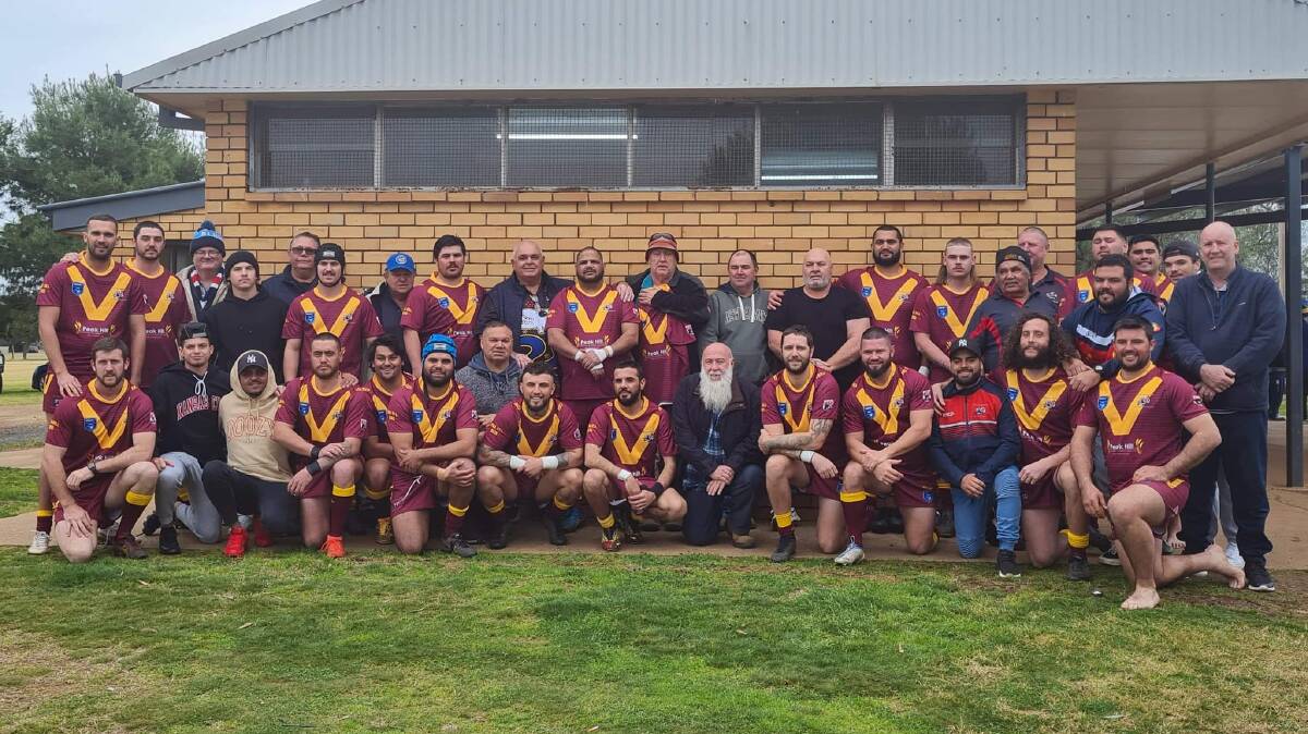 MILESTONE MATCH: Peak Hill's first grade side with their old boys. Photo: Kelli Edwards 
