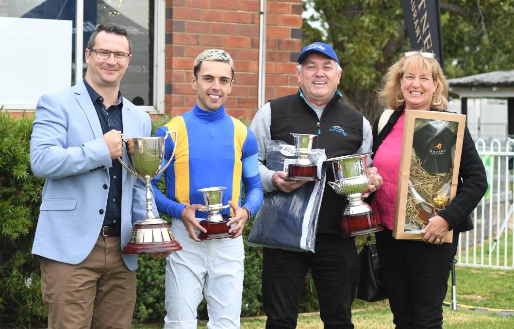 STRIKING GOLD: Luke Campbell from Southerncross Austereo, Ashley Morgan, Bjorn Baker Racing foreman Glen Lobb and Jane West from Racing Orange. Photo: JUDE KEOGH 