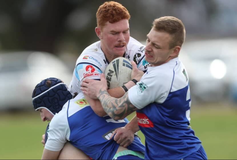 HIT-UP: Chris Anderson runs into St Pat's defence. Photo: PHIL BLATCH 