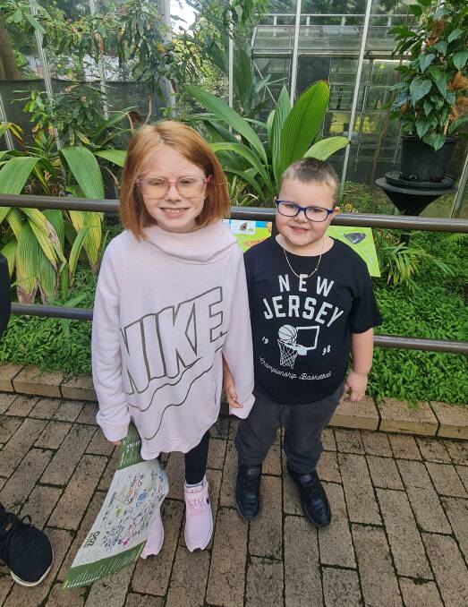CLOSE: Sister Jess, 8, and Caleb visit the Butterfly House at Melbourne Zoo. Picture: Supplied