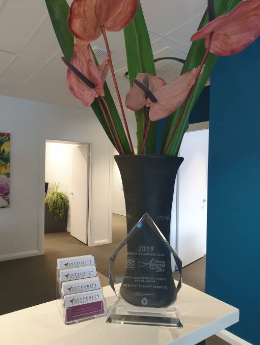 Recognition: The award win takes pride of place at Integrity Therapy Services, reward for the team doing the best job they possibly can every time. Photo: Supplied.