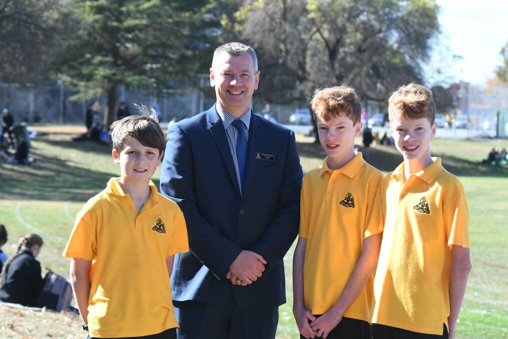 Fresh Faces: New Orange High School (OHS), Principal Chad Bliss, with Year 7 students Ethan Lynch, Sam Wilson and Toby Wilson. Photo: Jude Keogh.