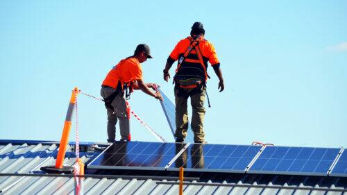 NEW ENERGY: Contractors have begun installing solar panels on council buildings this week, including the Civic Centre and pound. PHOTO: SUPPLIED
