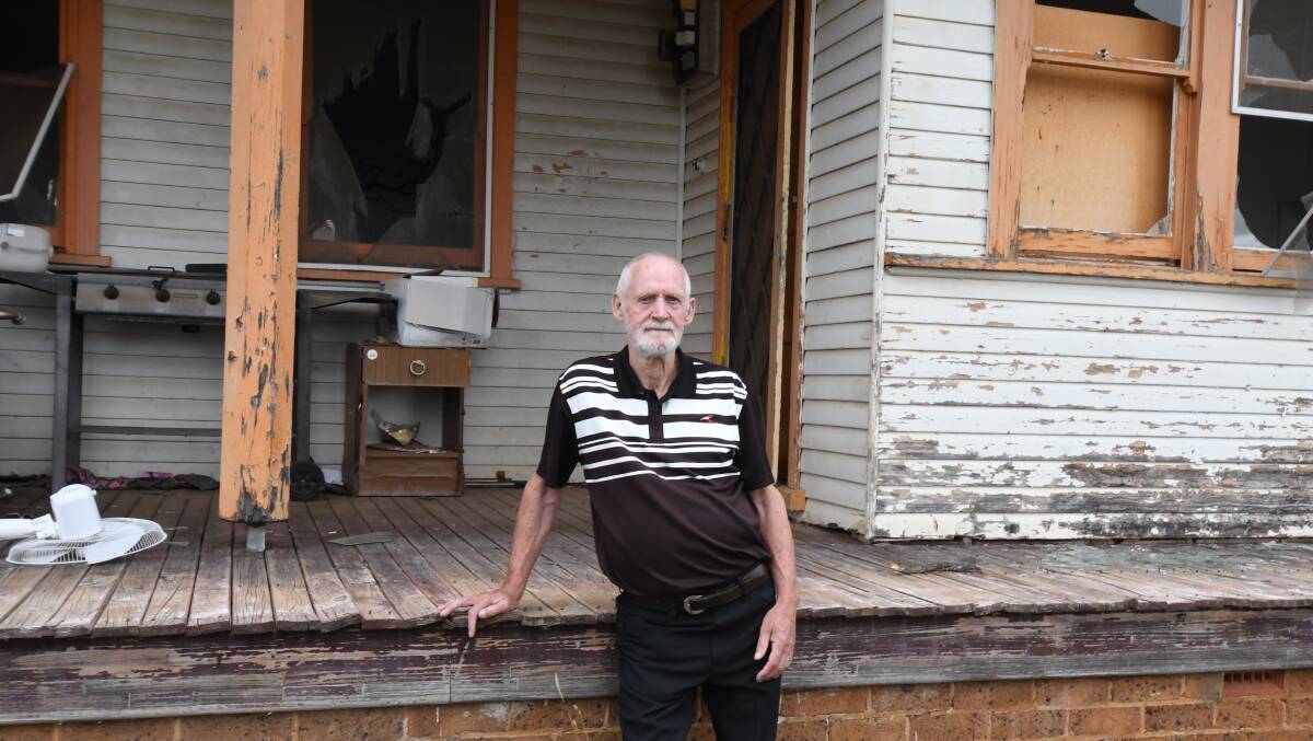 John Barron outside the "Orange Cottage": one of Fairbridge Farm's many dilapidated buildings. The veteran's visit to the site on Saturday was his first time back there in over 40 years. Photo: Carla Freedman 