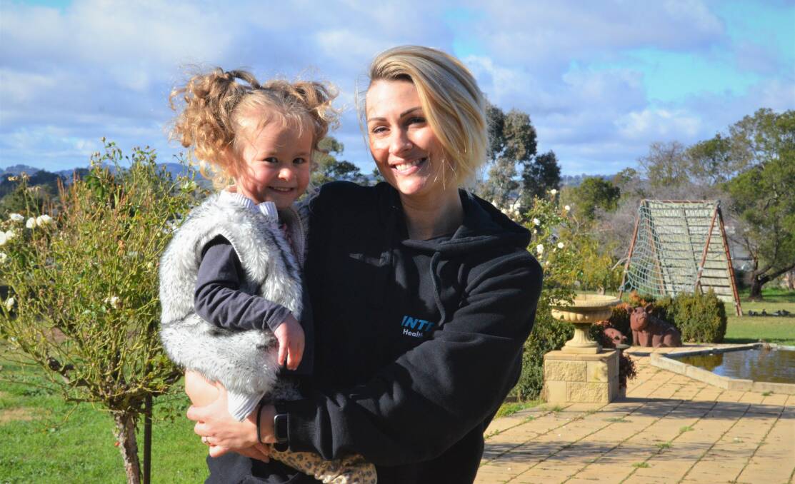 Bowie and her mum Coralie Mawter who works at Integra Health Service. The gym is hosting a Kids' Fun Day fundraiser for children like Bowie who were born with genetic conditions. PHOTO: ALANA CALVERT