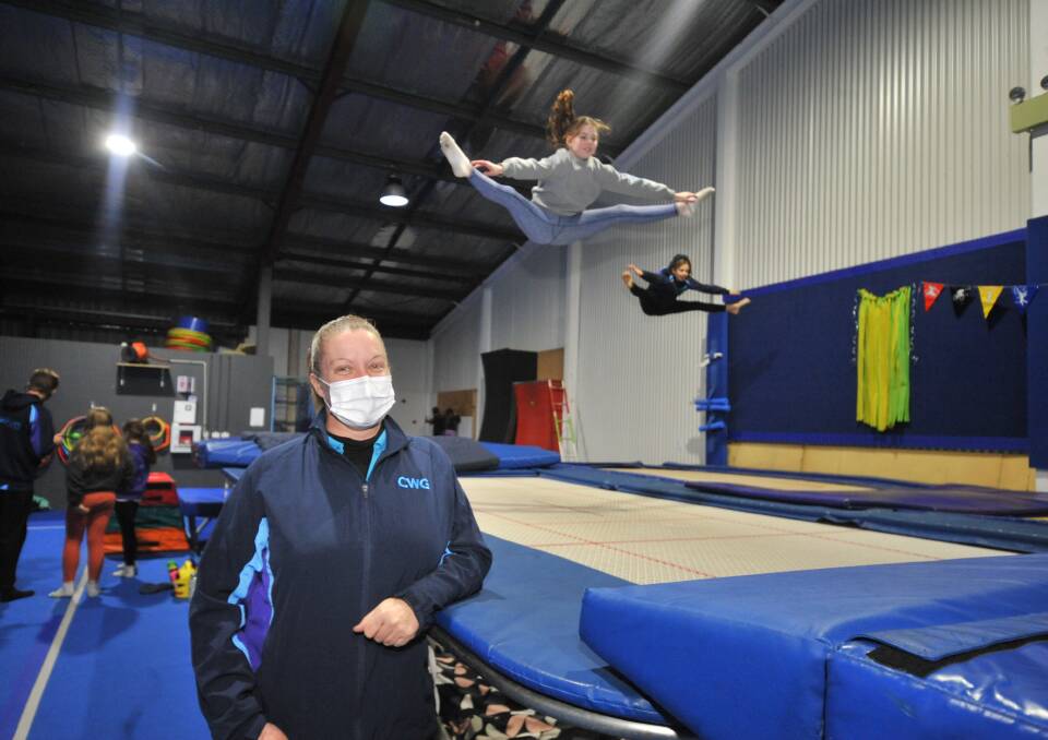 COMMUNITY HERO: Central West Gymsports volunteer Shaye Morris with trampoline students Sienna Gleeson and Ally Ward. PHOTO: JUDE KEOGH