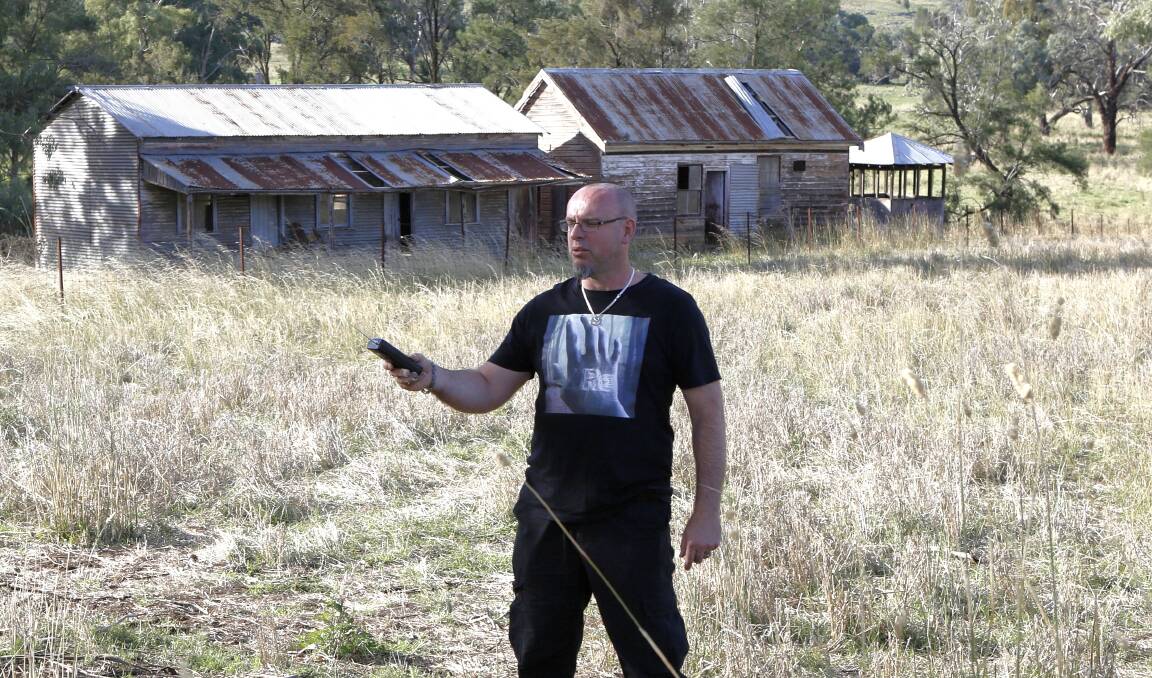 FREAKY FIELD WORK: Paranormal investigator Phil Henderson from XRealm. PHOTO: CHRIS PAWLOW