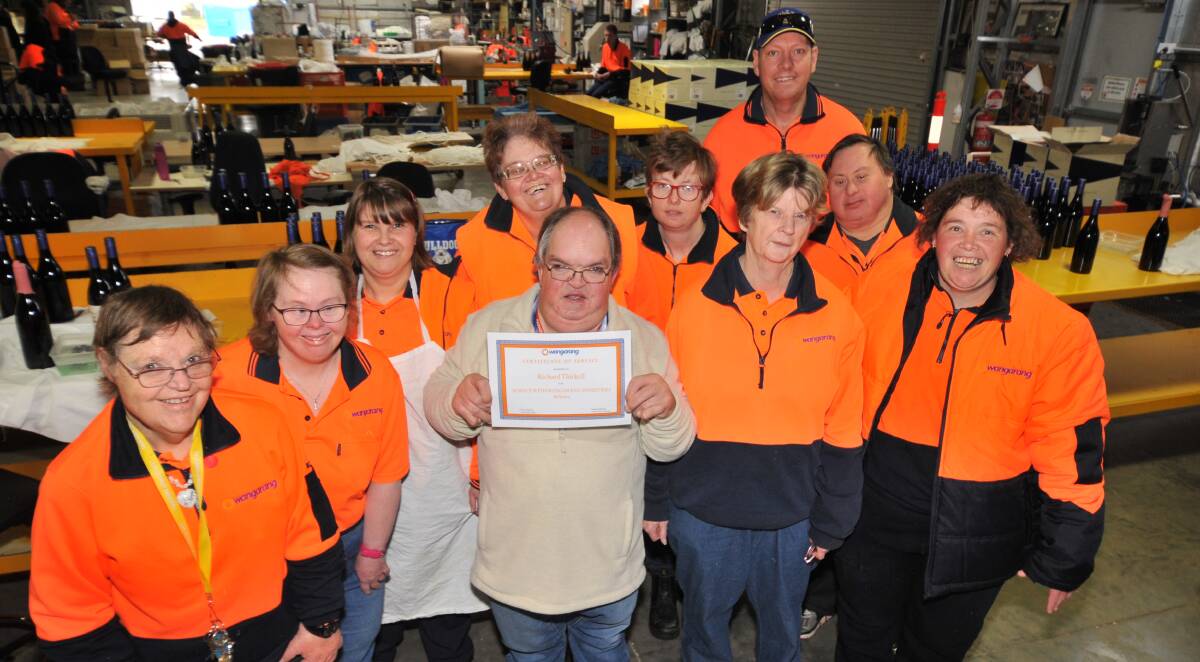 HARD WORKER: Richard Thirkell (centre) surrounded by his Wangarang colleagues and friends: Ann Kingham, Louise Hawkey, Natalie Martin, Fiona Fisher, Steffi Ward, Micheal Dunworth, Narelle Davies, Jeremy Zelukovic and Glenda Payne. PHOTO: JUDE KEOGH