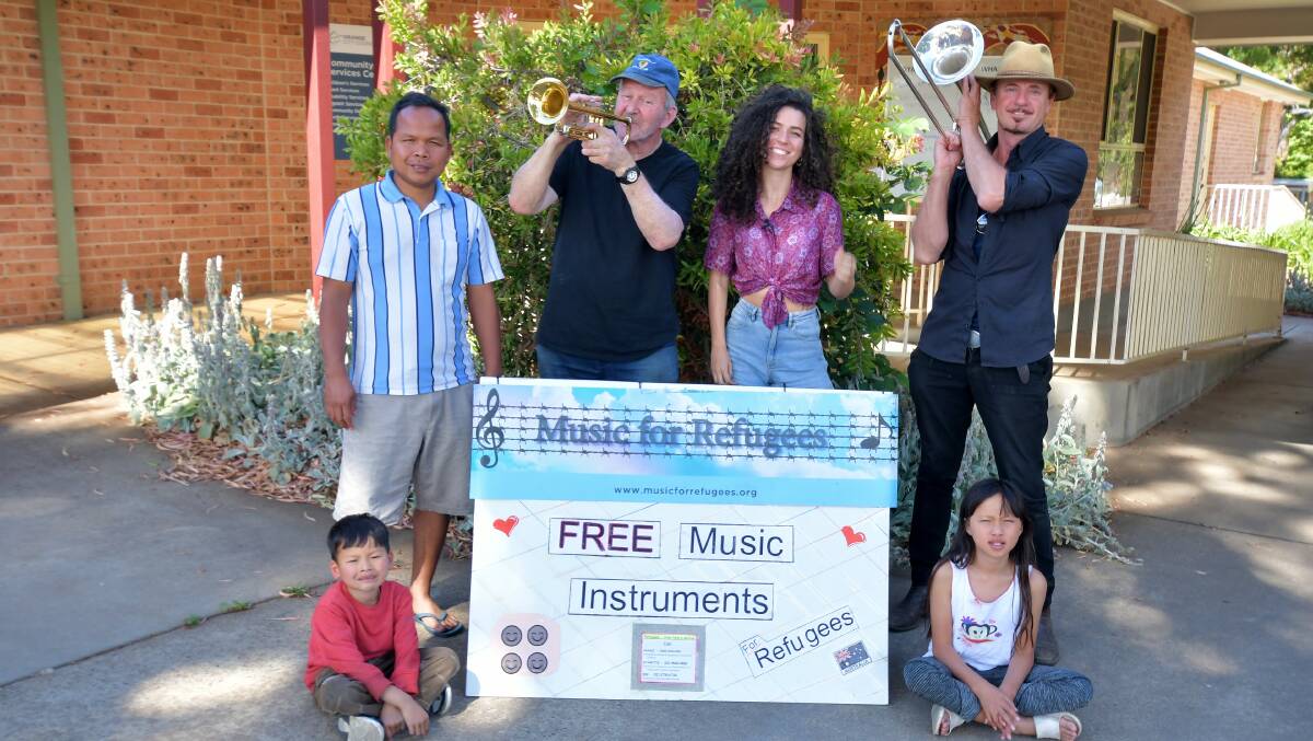SONGS FOR THE SOUL: Chanthorn Sok, Vichetra Thorn (in front) and Honsometa Thorn with volunteer music teachers, Philip Feinstein (centre), Grace Hickey and Hugh Murray. PHOTO: CARLA FREEDMAN