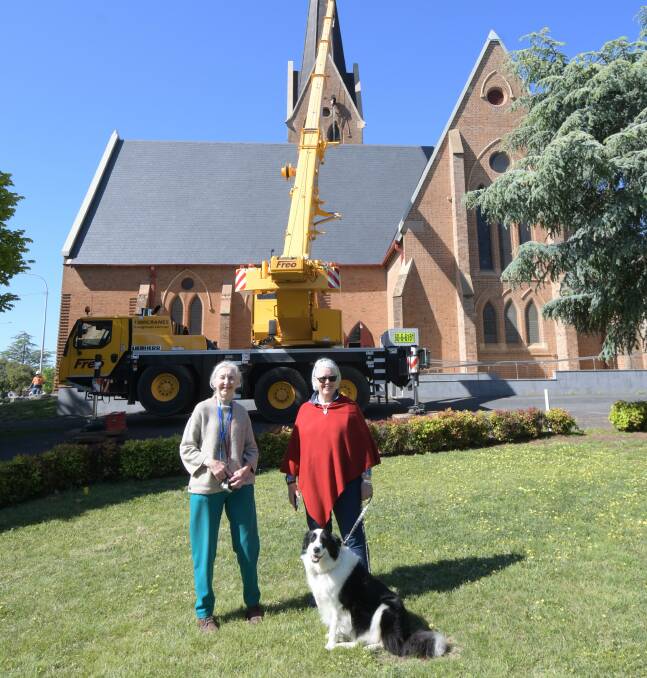 RINGING IN THE GOOD NEWS: Holy Trinity Anglican Church tower captain Joy Fabry with fellow parishioner Jennifer Derrick and Bailey the border collie were on hand to supervise the bell's installation. PHOTO: CARLA FREEDMAN