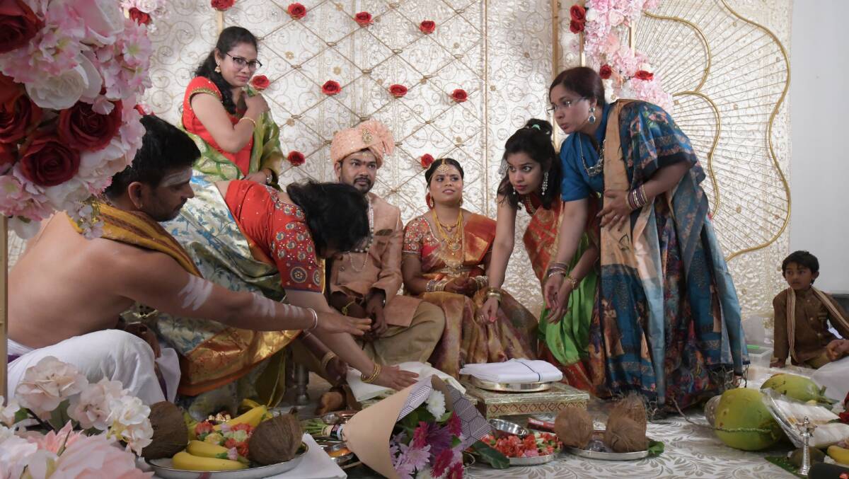 Achar (priest), mother-of-the-bride Anantha Maddirala, Usha Sunke, groom Krishna Teja, bride Sri Ramya, Sai Shruthi, Divya Kattn and (far right) Ananjan Jeevasangar. PHOTO: JUDE KEOGH 