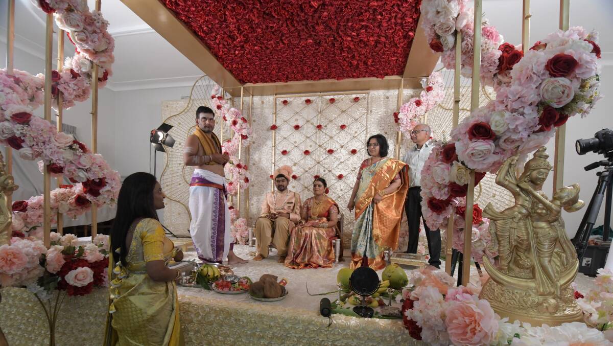 Achar (Hindu priest), Krishna Teja (groom) and Sri Ramya (bride) with her mother, Anantha Maddirala, and father, Venkat Pullepu. In foreground- Prasanna Rongali. PHOTO: JUDE KEOGH 