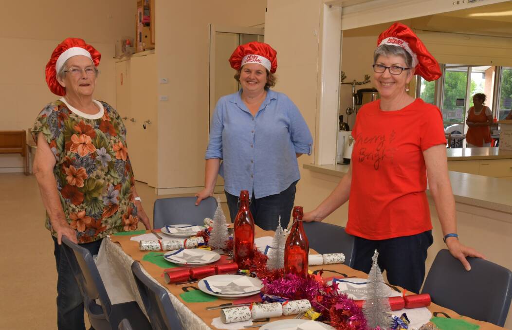 EVERYONE'S INVITED: Molong Community Christmas Day Lunch volunteers Lesley Bye, Julie Spencer and Kate Doyle. PHOTO: JUDE KEOGH