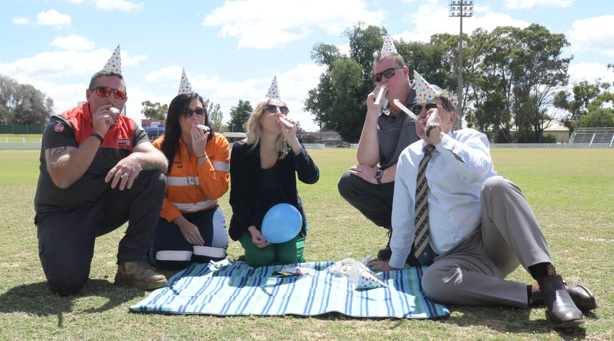 PARTY TIME: Luke Compt from Kennards, Melissa O'Brien from Newcrest, Holly Manning, Craig McMahon from Kennards and mayor Reg Kidd at Wade Park. PHOTO: CARLA FREEDMAN 