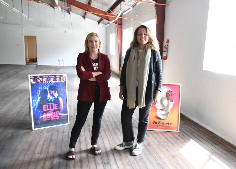 BIG MOVES: Arcadia producer Bec Janek and head of acquisitions and distribution Alex Burke inside their company's new warehouse which used to be the old API building. PHOTO: JUDE KEOGH