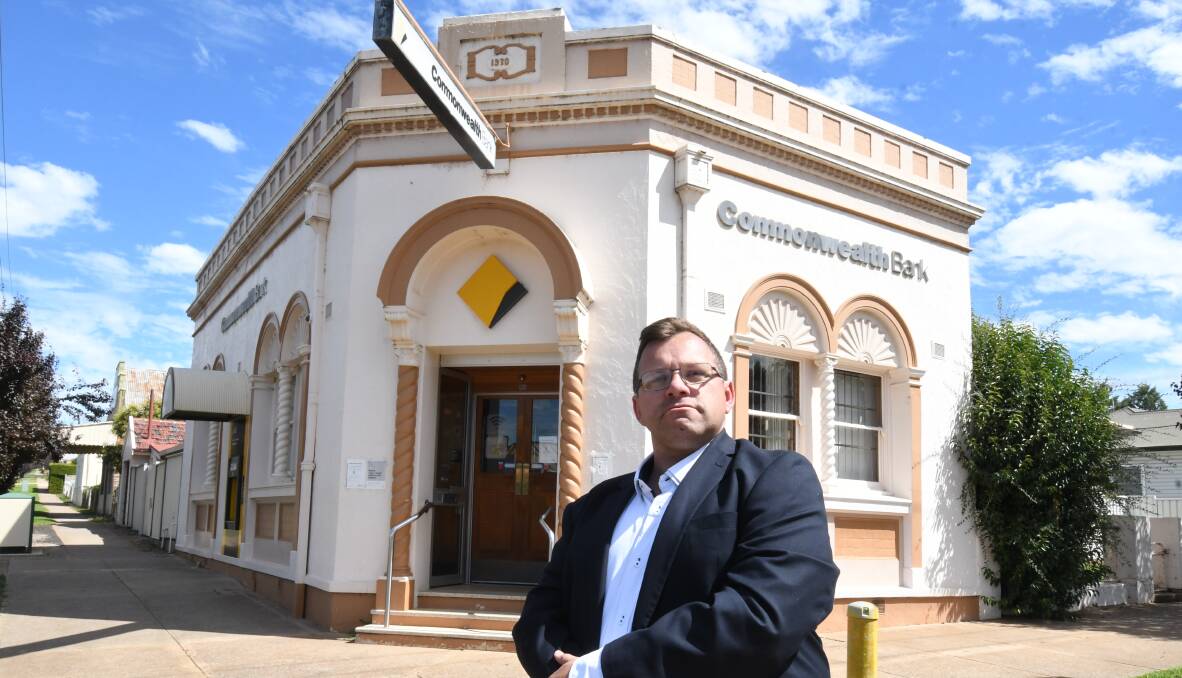 OUTRAGE: Molong resident Aaron Pearson has created a petition against the impending closure of the Commonwealth Bank. PHOTO: JUDE KEOGH