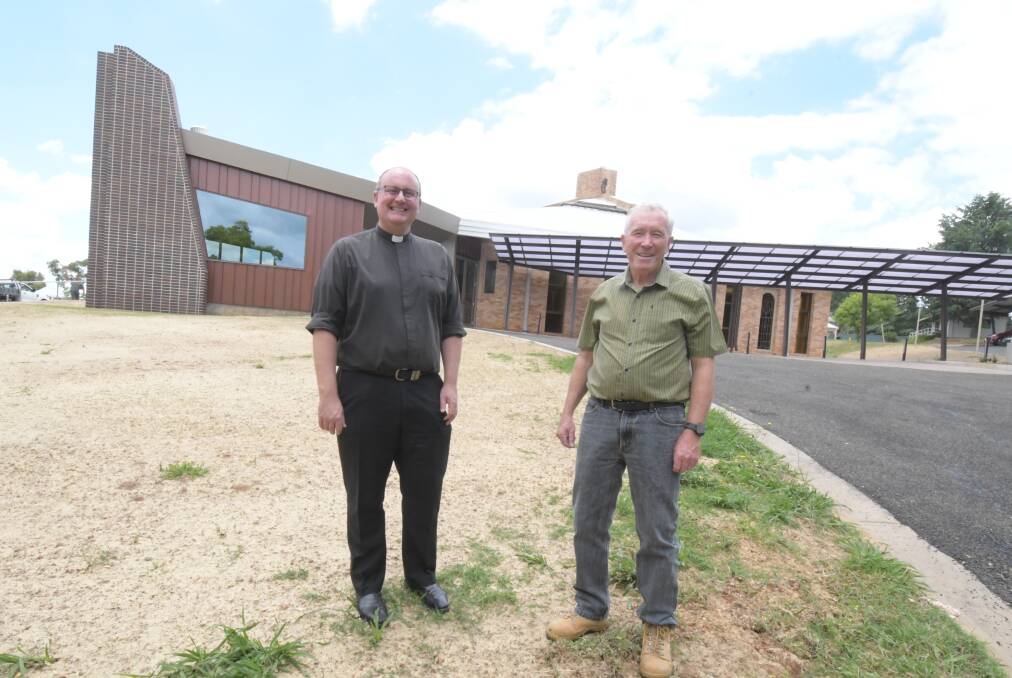COMPLETE: Father Greg Bellamy and church volunteer Michael O'Mara outside the newly restored St Mary's. PHOTO: JUDE KEOGH