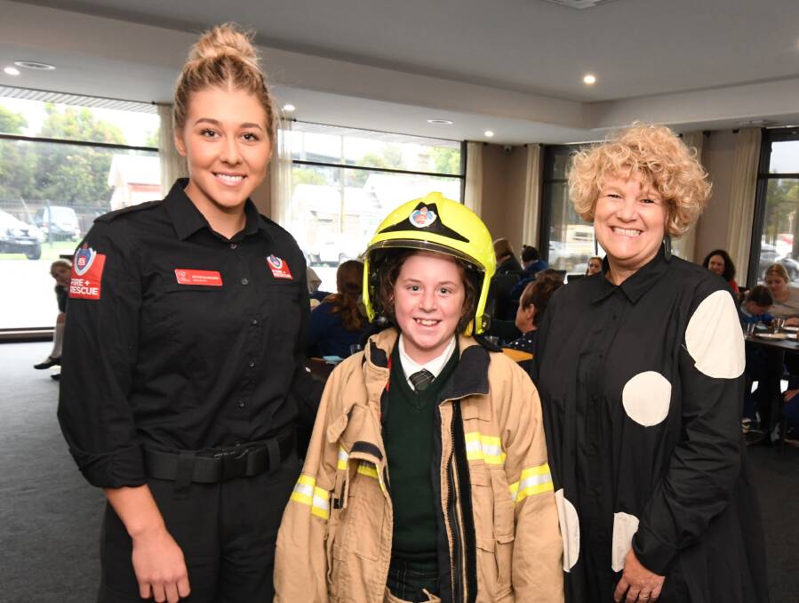 TACKLING STEREOTYPES: Firefighter Brydie McGregor with student Grace Lingier and principal Ann Marie McAnulty. PHOTO: JUDE KEOGH 