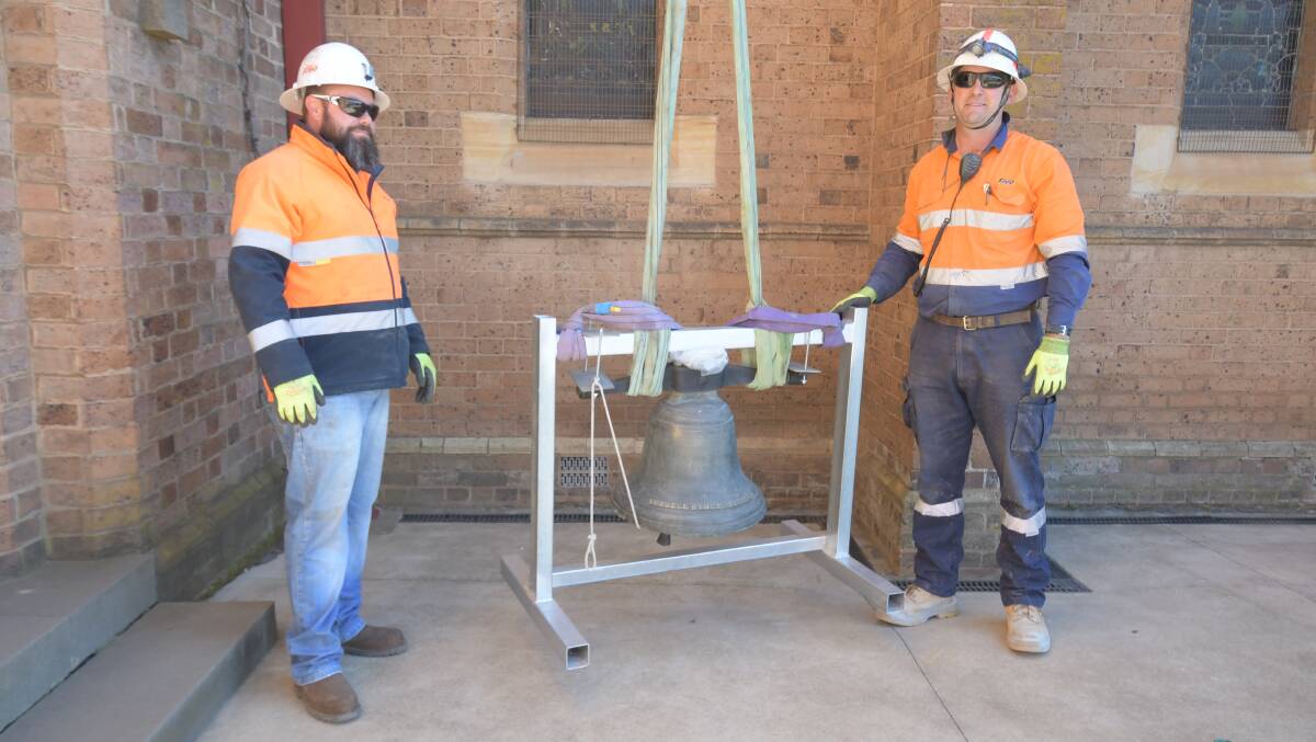 Josh Dutton and Clinton Neville were among the team of four from Freo Cranes who donated their time and equipment for the day to install the bell. PHOTO: CARLA FREEDMAN