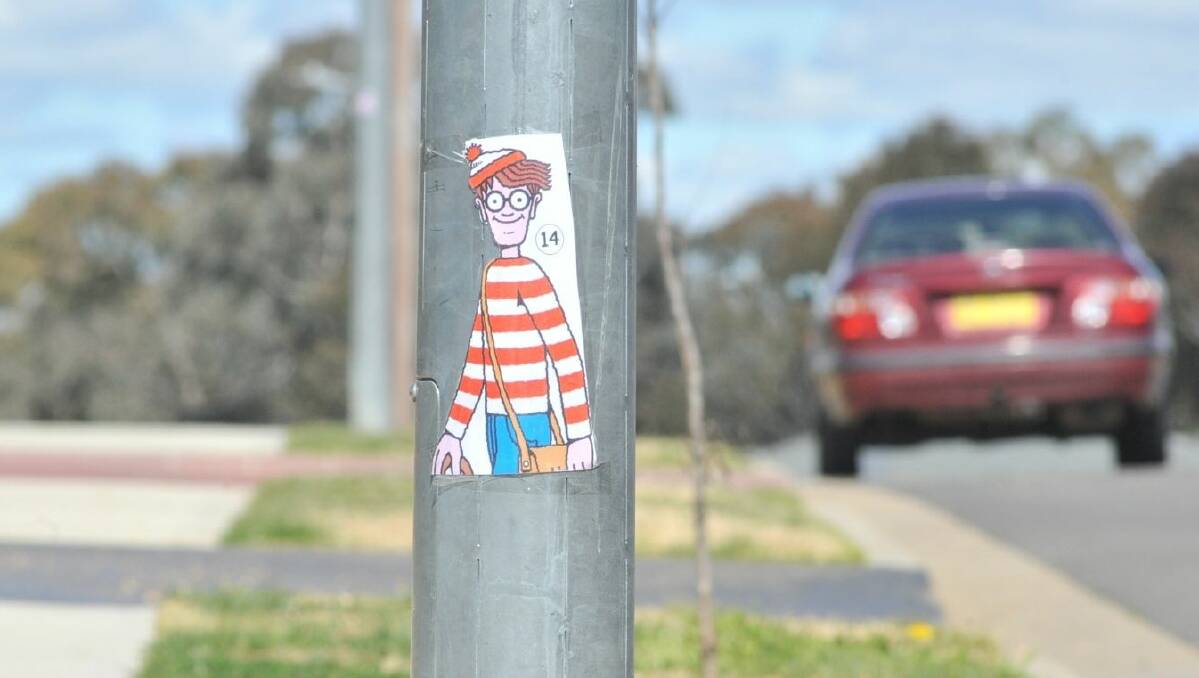 TREASURE HUNT: One of around 40 pictures of Wally and his friends that have been posted around North Orange for people to find. PHOTOS: JUDE KEOGH