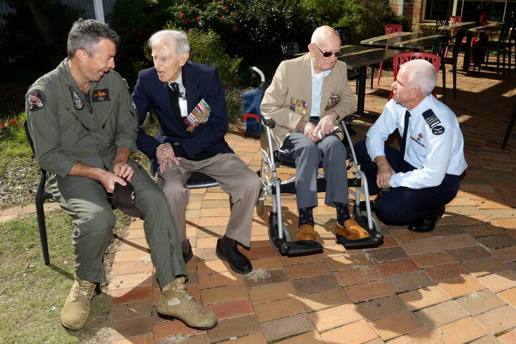PAST AND PRESENT: Flying Officer James Bailey, Sid Handsaker, Charles "Clem" Jones, and Wing Commander Rick Dyson swap plane stories. Pictures: Jonathan Carroll