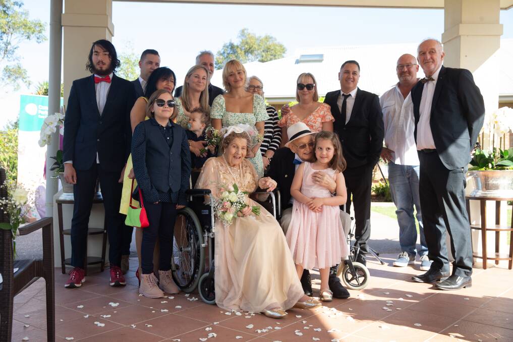 Members of the Hill family with the newlyweds. Picture: Marina Neil