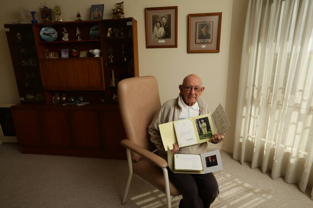 Clem Jones with messages of congratulations from the Queen, Prime Minister Scott Morrison and the Governor-General, David Hurley, for his 100th birthday. Picture: Jonathan Carroll 