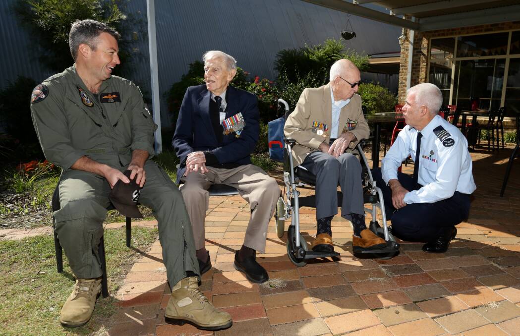 PAST AND PRESENT: Flying Officer James Bailey, Sid Handsaker, Charles "Clem" Jones, and Wing Commander Rick Dyson swap stories. Pictures: Jonathan Carroll