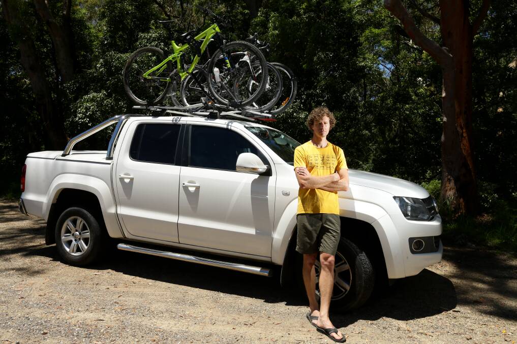 Tim Haasnoot with bikes on the roof of his ute, which led to him paying higher tolls. Picture: Jonathan Carroll