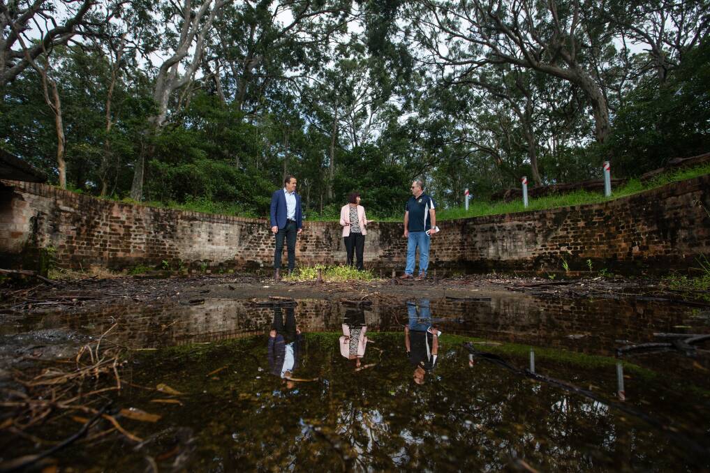 PAST REFLECTIONS: Lake Macquarie City Council's Tim Browne, mayor Kay Fraser, and Scott Munro, from the Wangi Wangi RSL Sub-branch at the emplacement. Pictures: Marina Neil