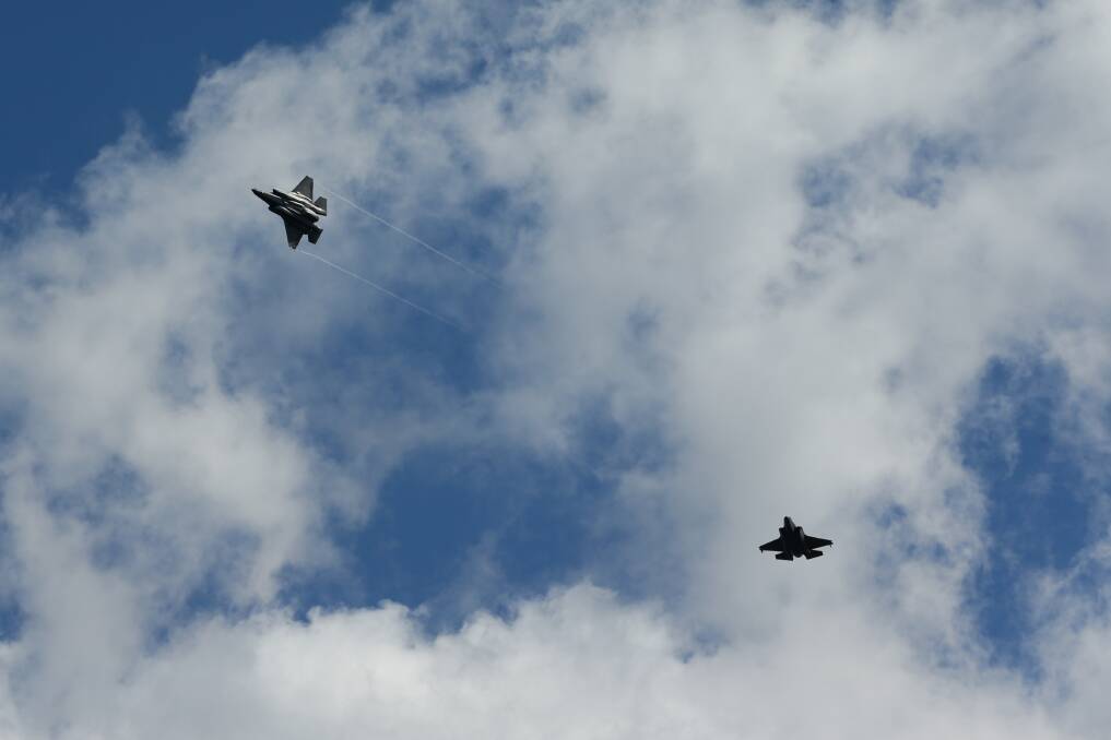 Two F-35A Lightning II fighter jets fly over Williamtown. Picture: Jonathan Carroll