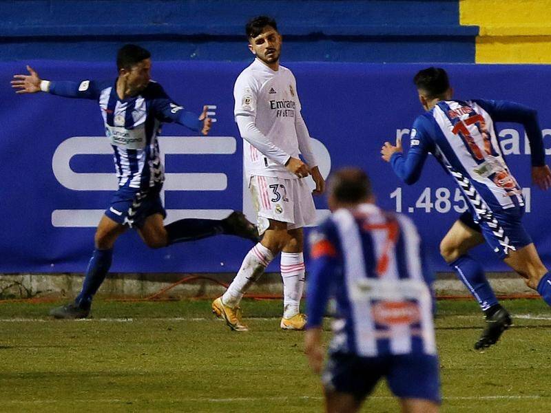 Alcoyano's Juanan (l) has scored the winning goal in their Cup tie with Real Madrid.