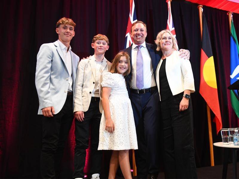 New Queensland Premier Steven Miles poses with his wife Kim and family after he was sworn in. (Jono Searle/AAP PHOTOS)