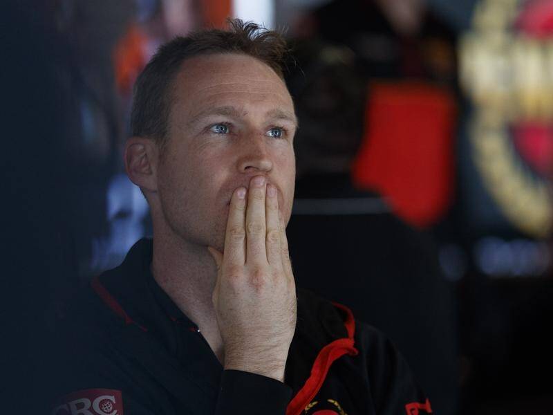 David Reynolds looks on after co-driver Luke Youlden crashed during practice at Mt Panorama.