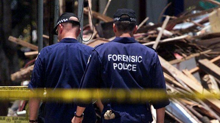 The Australian forensic officers from WA look for evidence Bali bombing site in 2002. Photo: Kate Geraghty