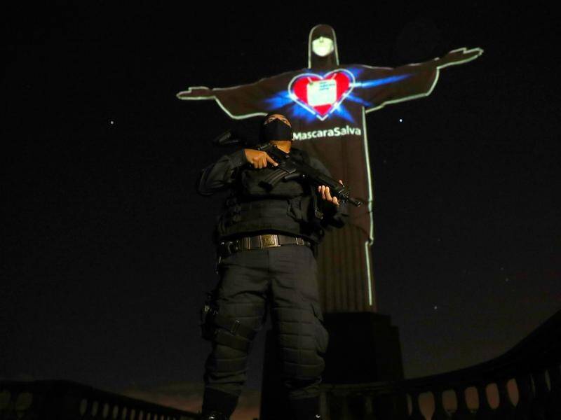 Brazil's Christ the Redeemer statue has been lit up with a face mask to promote virus self care.