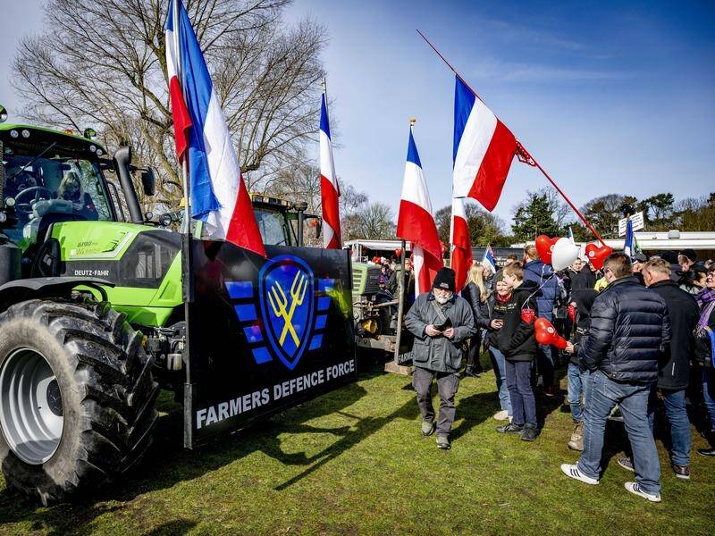 Protesters, many carrying the upside-down Dutch flag synonymous with farmers' demos, have rallied. (EPA PHOTO)
