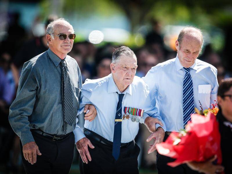 Veteran Mervyn Ey(centre) was among those honoured at Darwin bombings 77th Anniversary commemoration