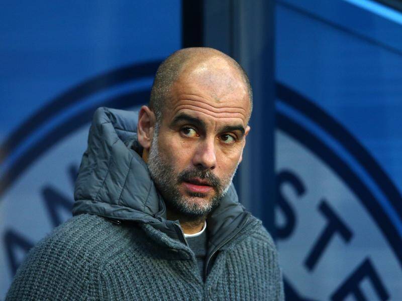 Pep Guardiola says he is committed to Manchester City for at least two more years after this season.