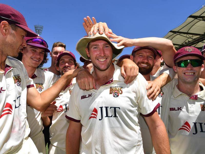 Queensland icelebrate their Sheffield Shield win over South Australia at the Gabba.