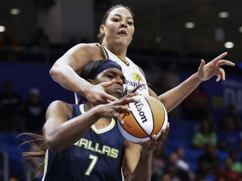 Los Angeles's Liz Cambage overpowered Dallas to lead the Sparks to a 97-89 win in the WNBA.