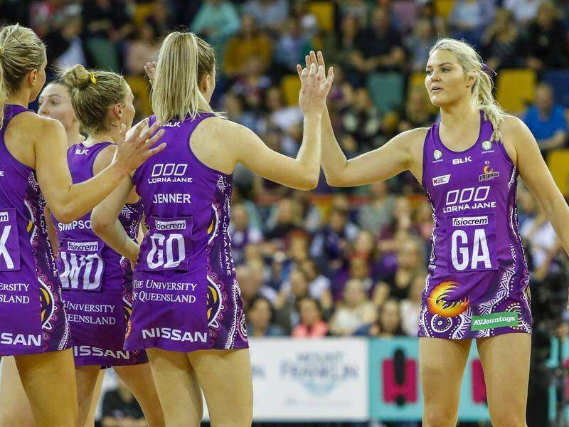 Gretel Tippett (r) hit 29 goals for the Firebirds as they beat the Giants 64-50 in Super Netball.