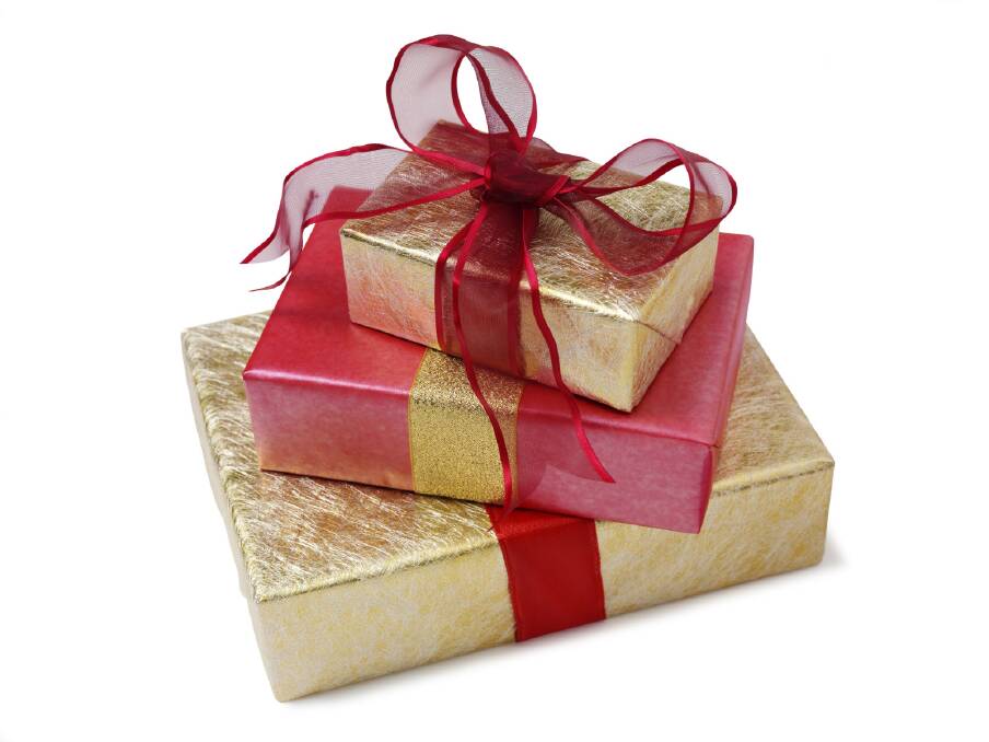 A generic photo of gold wrapped presents with red ribbon. Picture is from iStockphoto