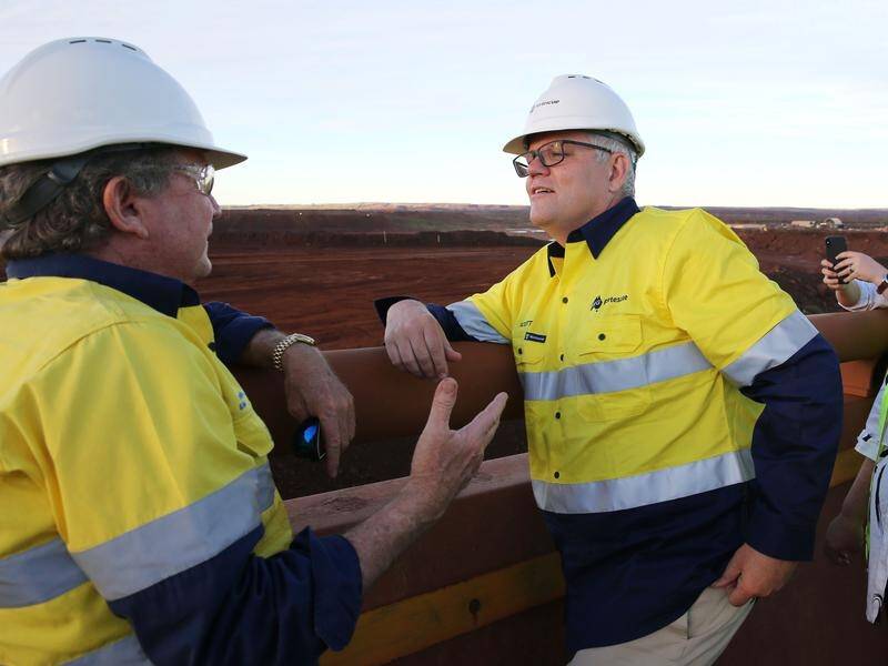 Scott Morrison is visiting the Pilbara region, discussing emission-reduction targets.