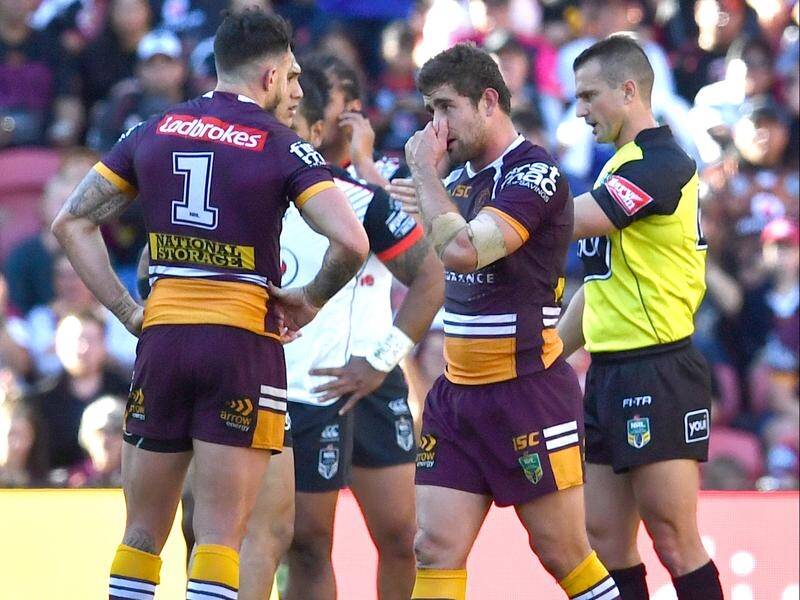 Brisbane's Andrew McCullough (c) was sent to the sin bin in the NRL loss to the Warriors.
