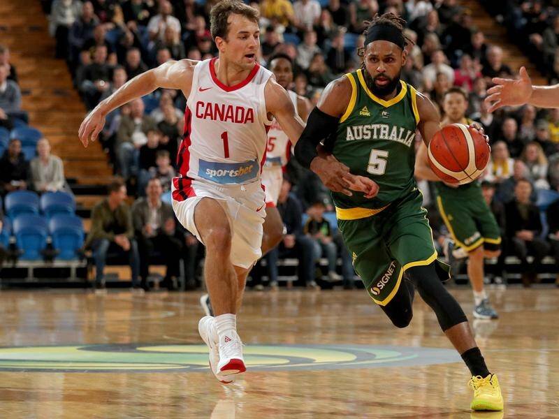 Patty Mills has top-scored in Australia's 20-point basketball World Cup warm-up loss to Canada.